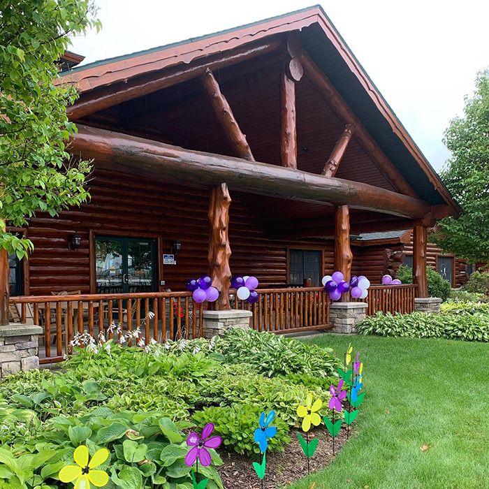 Covered porch area with tables and flowers